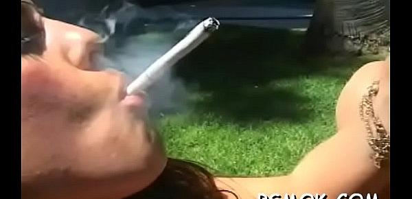  Breathtaking chick enjoyable herself with a cigarette